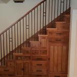 Custom cabinetry under stairs.