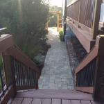 Composite decking with stone pathway.